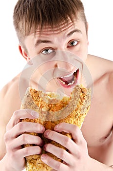Hungry Young Man eating bread