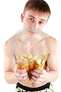 Hungry Young Man eating bread