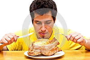 Hungry young man waiting to eat chicken