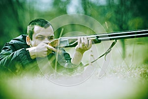 Hunter aiming Shotgun photo