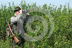 Hunter with binoculars