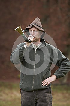 Hunter blowing horn