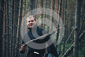 Hunter Fisherman is Posing on Forest River Coast