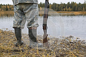 Hunter with a gun . Autumn duck hunting