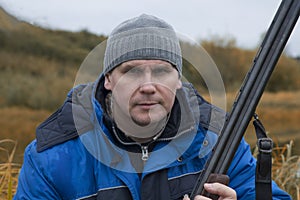 Hunter with a gun . Autumn duck hunting