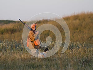 Hunter with his dog in the early morning