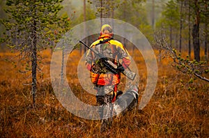 Hunter and his elkhound outdoor - hunting season