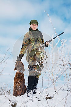 Hunter with his hunting dog waiting for the hunt