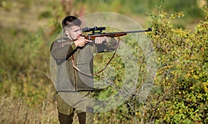 Hunter hold rifle. Hunting is brutal masculine hobby. Hunting and trapping seasons. Bearded serious hunter spend leisure