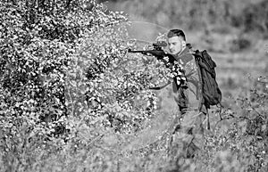 Hunter hold rifle. Man wear camouflage clothes nature background. Hunting permit. Hunting is brutal masculine hobby