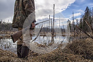 Hunter holds in his hand an old hunting rifle