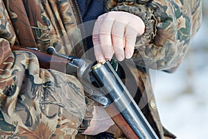 Hunter loading his old russian double-barreled side by side shotgun