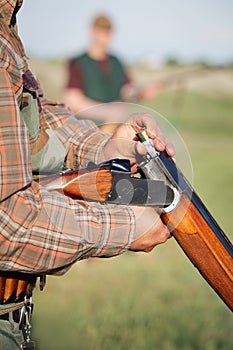Hunter loading shotgun