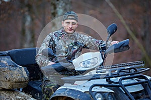 Hunter on quad bike