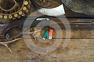 Hunter`s equipments on old wooden background