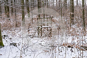 Hunter's stand in the winter forest