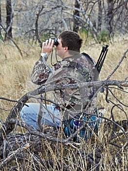 Hunter scouting with binoculars