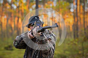Hunter shooting a hunting gun photo