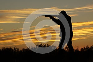 Hunter Shooting in Sunset photo