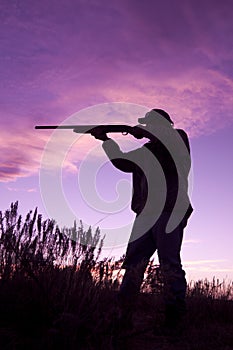 Hunter Shooting in Sunset