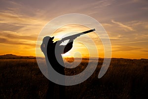 Hunter Shooting in Sunset