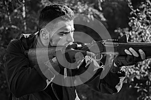 Hunter with shotgun gun on hunt. Autumn hunting season. Autunm hunting. Hunting without borders. Gun rifle. photo