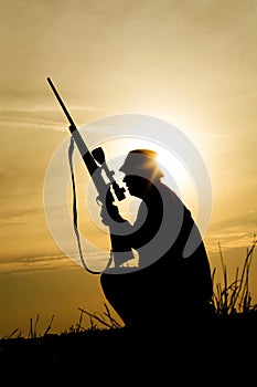 Hunter With Shotgun in Sunset