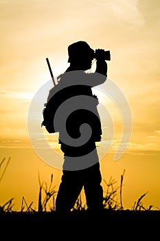 Hunter With Shotgun in Sunset