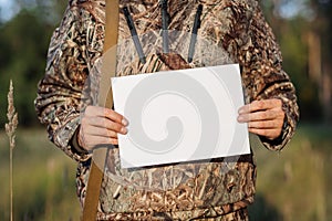 Hunter Showing Paper On Clipboard against