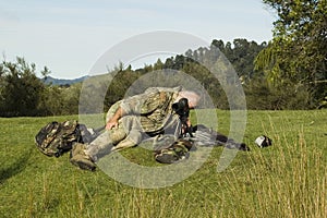 Hunter with spotting scope photo