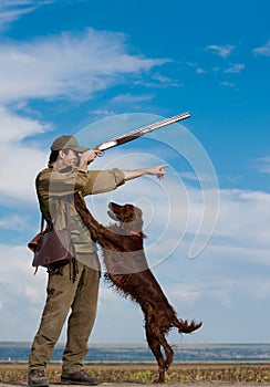 Hunter training his dog during a hunting party