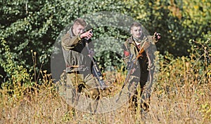 Hunters gamekeepers looking for animal or bird. Hunting with friends. Hunters friends enjoy leisure. Hunters with rifles