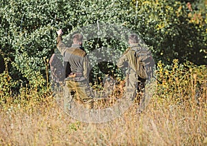 Hunters gamekeepers looking for animal or bird. Hunting with friends. Hunters friends enjoy leisure. Teamwork and