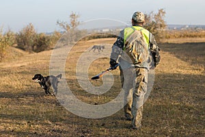 Hunters with a gun and german drathaar. Pigeon hunting with dogs.s