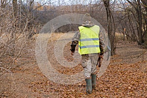 Hunters with a gun and german drathaar. Pigeon hunting with dogs.s