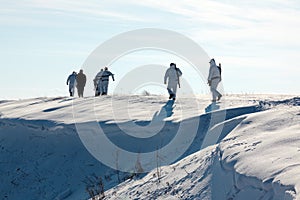 Hunters walking in snow