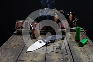 Hunting concept. Smoking cradle and knife. Hunter items