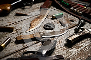 Hunting equipment on wooden background