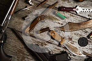 Hunting equipment on wooden background