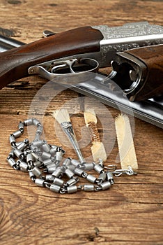 Hunting gun with cleaning kit on a table