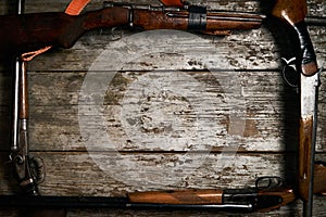 Hunting guns frame on wooden table