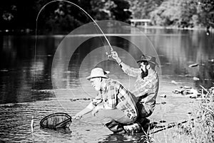 Hunting. happy fishermen friendship. Catching and fishing. Two male friends fishing together. retired dad and mature
