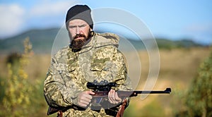 Hunting masculine hobby. Man brutal gamekeeper nature background. Bearded hunter spend leisure hunting. Hunter hold photo