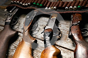Hunting rifles with leather bandolier with ammunition