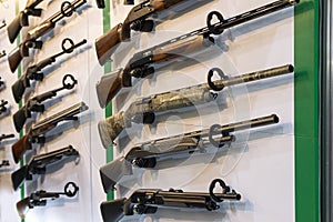 Hunting rifles on the stand of the store