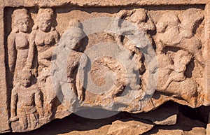 Hunting scene, carved sculpture on historical wall of indian stone temple in Pattadakal, India