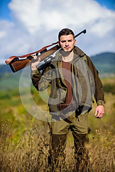 Hunting season. Hunting weapon gun or rifle. Man hunter carry rifle nature background. Experience and practice lends