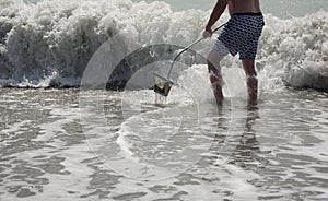 Hunting for shark teeth on Venice beach Florida