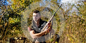 Hunting skills and strategy. Man hunting wait for animal. Hunter with rifle ready to hunting nature background. Hunting photo