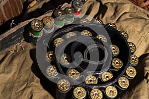 Hunting still life, hunter cartridge belt with shotgun shells.